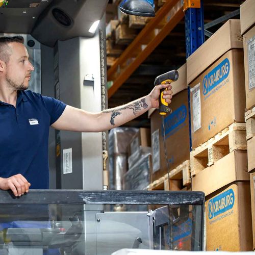 Employee scans packages